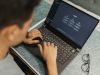 Person at a laptop with ChatGPT on the screen
